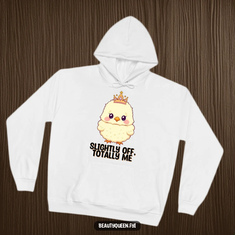 Funny Hoodie with a fluffy chick sporting a tiny, sparkly tiara askew, radiating cuteness and a touch of playful rebellion.