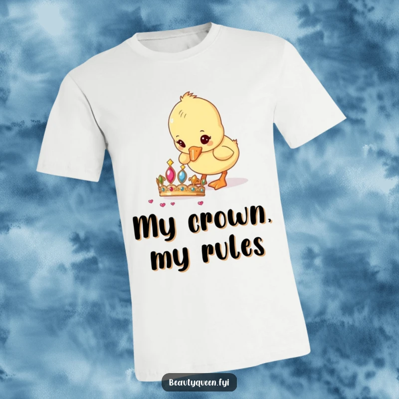 Funny Duckling T-Shirt depicting a curious baby duckling pecking at a shiny tiara, capturing a moment of adorable discovery.