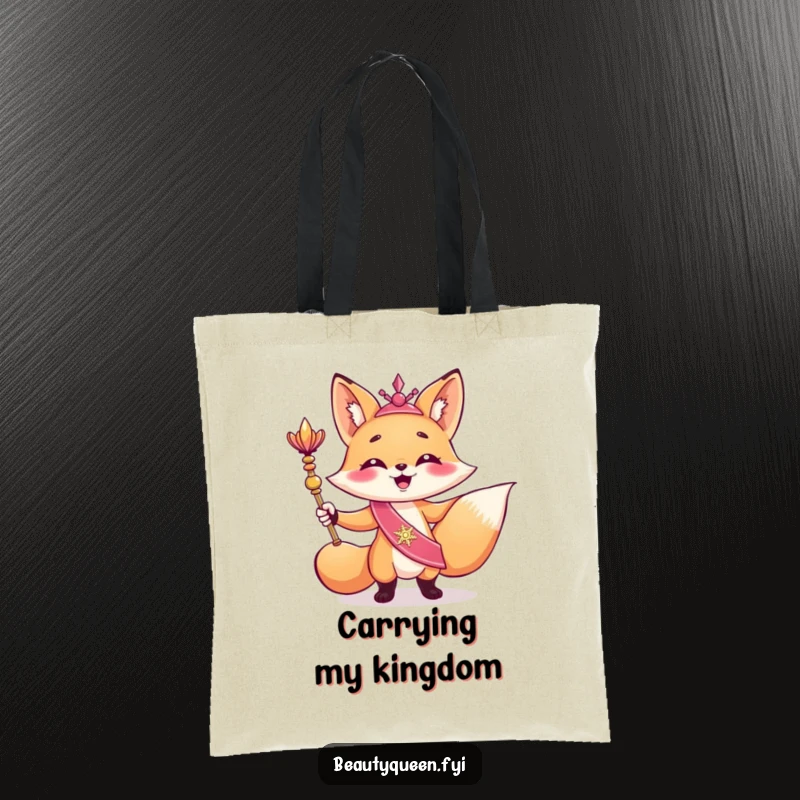 Funny tote bag with a giggling fox in a sash holding a scepter, striking a triumphant and regal pose with a humorous expression.