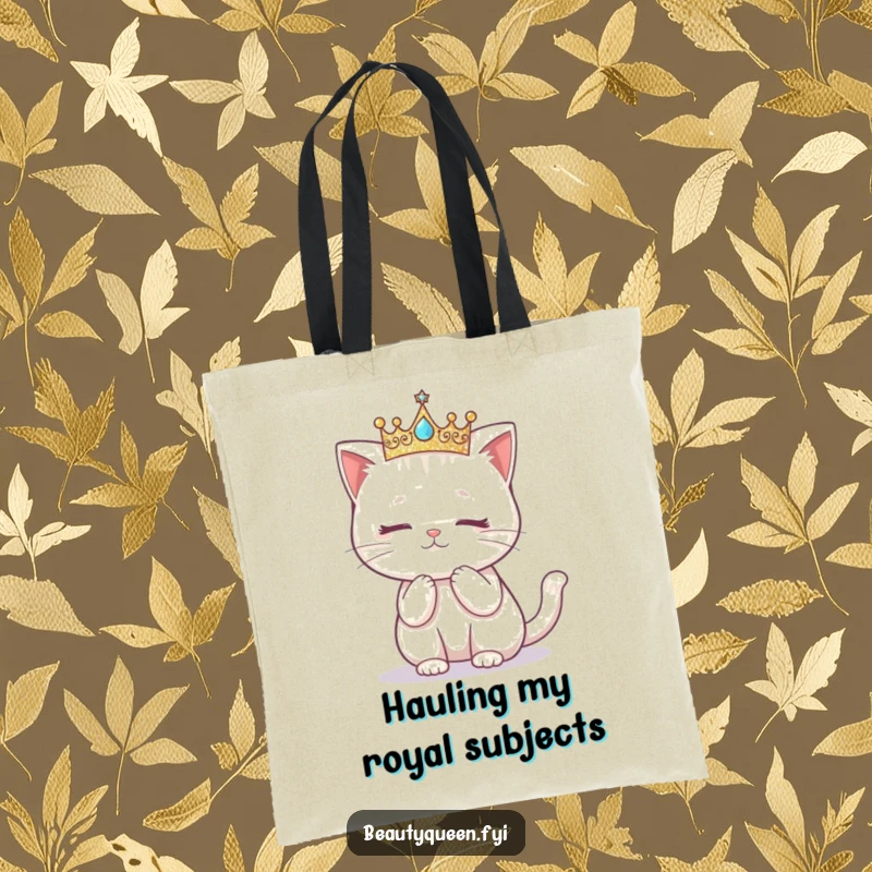 Funny tote bag showcasing a kawaii cat in a glittering crown, attempting a graceful curtsy.